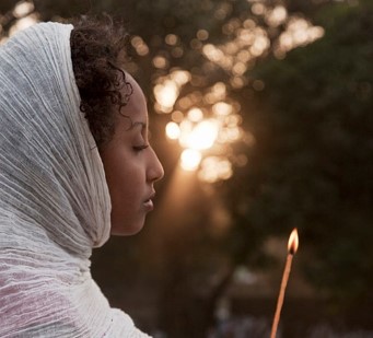 Amhara woman with candle light